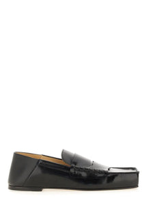 Black patent leather loafer with glossy finish and classic moccasin design from jacquemus women’s moccasin carre black