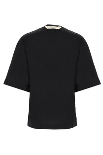 Jacquemus women’s black short-sleeved relaxed fit shirt with subtle brand tag at the neckline