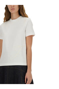 Jacquemus women’s white short-sleeved cotton t-shirt with subtle embroidered script logo on the lower front