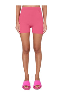 Jacquemus women’s fuchsia pink high-waisted shorts made from smooth stretchy fabric with small logo on waistband