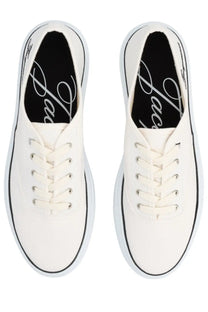 Jacquemus women’s sneaker é é white canvas sneakers with black piping and matching laces in a minimalist design