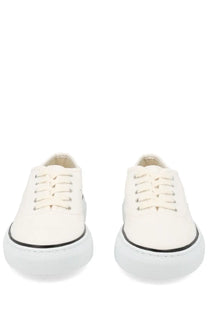 Jacquemus women’s sneaker É É white white canvas sneakers with black rubber soles and silver eyelets