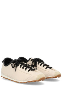 Cream-colored canvas jacquemus women’s sneaker tennis beige with black laces and tan rubber sole