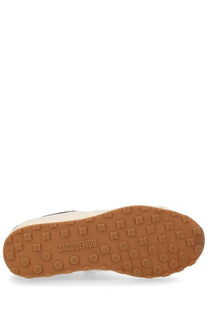Tan rubber sole with square and circular treads embossed with jacquemus on jacquemus women’s sneaker tennis beige