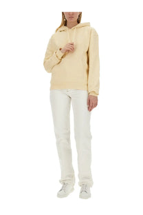Cream-colored oversized jacquemus women’s sweatshirt with drawstring hood and ribbed cuffs in yellow collection