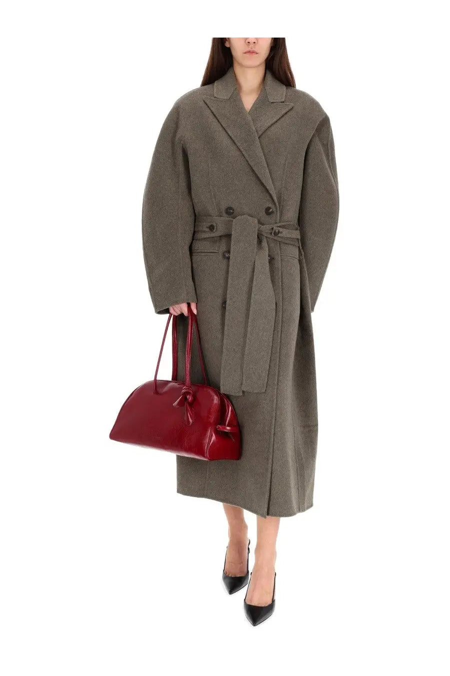 A glossy crimson handbag with a structured rounded shape and bow detail paired with jacquemus trench coat dhomme curvio grey