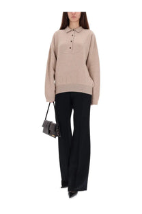 Beige oversized knit polo sweater by Jacquemus featuring a buttoned placket and ribbed cuffs