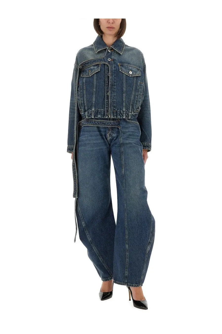 A dark blue denim jacket with a classic collar and two front pockets paired with jean paul gaultier low rise jeans