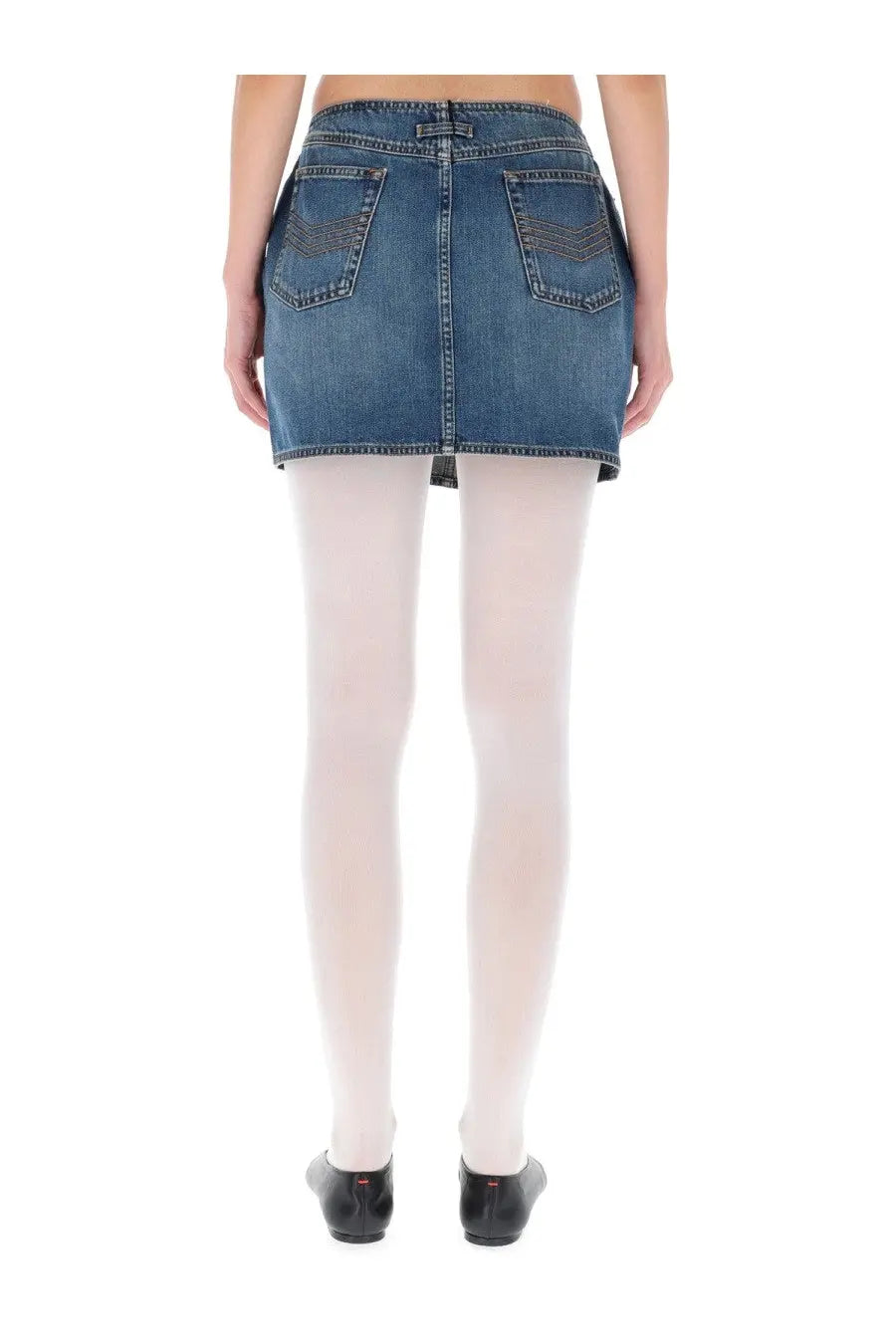 Blue denim mini skirt by jean paul gaultier with back pockets and button closure showing the back side