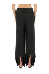 Jean Paul Gaultier women’s black wide-leg high waist trousers with front button pockets and hem slit