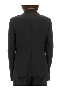 Jean Paul Gaultier women’s black tailored blazer with structured back and notched lapel shown from the back side