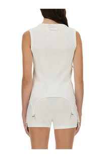 White ribbed knit sleeveless top by Jean Paul Gaultier with curved hem and side zipper details
