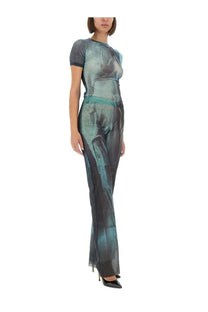 A sleek jumpsuit in teal and dark gray gradient with abstract semi-transparent print for women by Jean Paul Gaultier