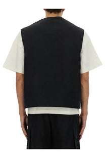 Black sleeveless Jil Sander men’s cargo vest with minimalist design and subtle seam detailing in cotton fabric