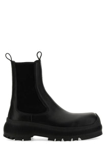 Jil sander men’s black leather chelsea boot with chunky ribbed sole and elastic side panels