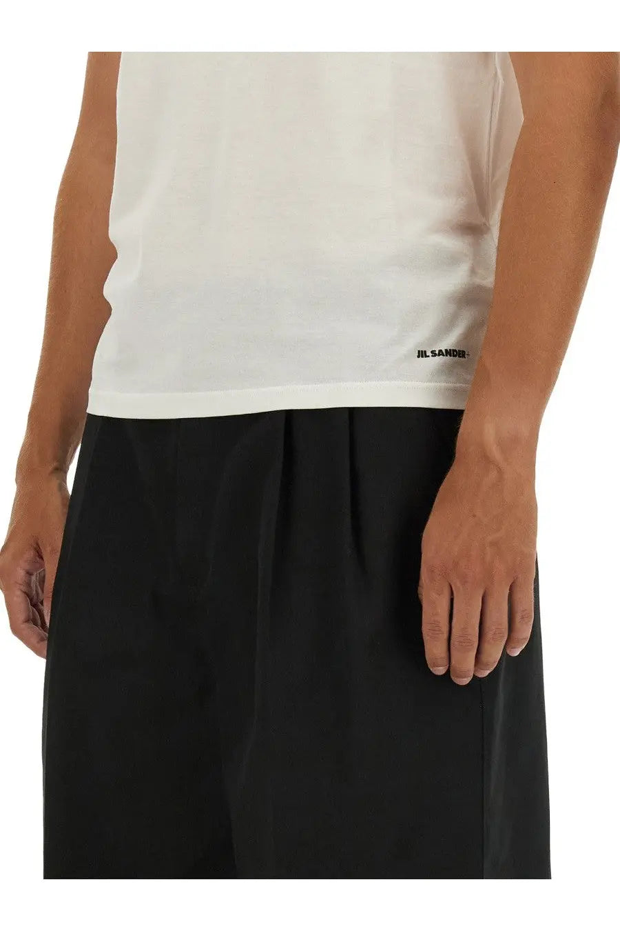 White sleeveless cotton top with black jil sander branding at the hem for men