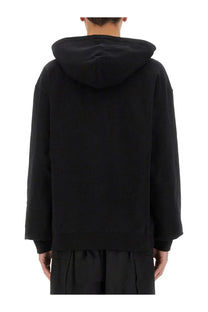 Jil sander men’s black hoodie with relaxed fit and ribbed cuffs made from soft cotton fabric