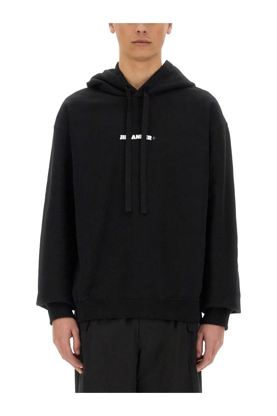 Black oversized hoodie with white jil sander logo across the chest for men in cotton material