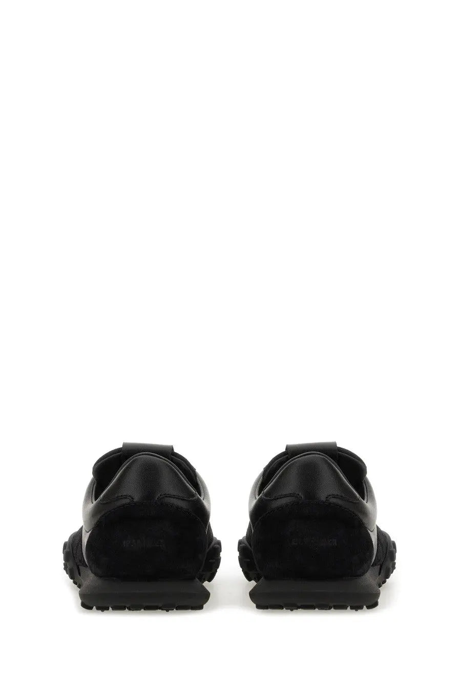 Jil Sander men’s low top sneaker in black leather with a chunky rubber sole and minimalist design