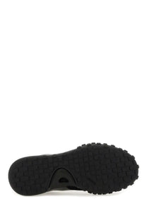 Black rubber sole with textured grid tread and subtle embossed logo near heel on jil sander men’s low top sneaker black