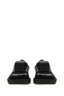 Jil Sander men’s low top sneaker in black with black suede and matte gray panels and a chunky rubber sole