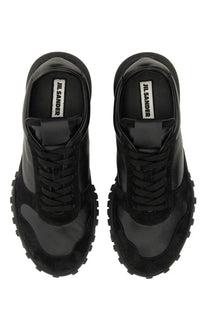 Jil sander men’s low top sneaker in black with black suede and patent leather and a chunky rubber sole