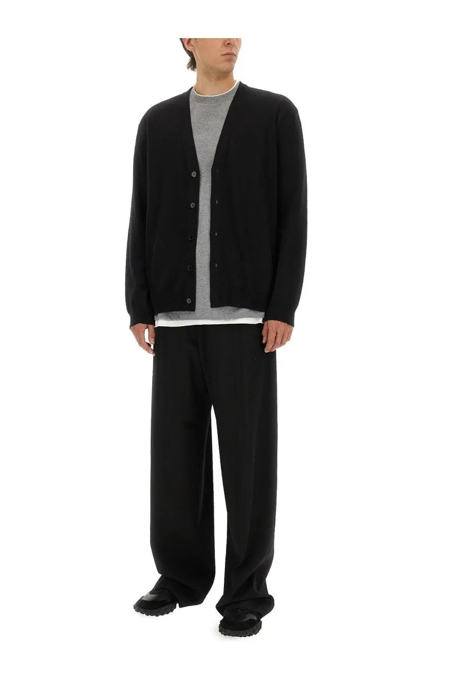 Black wool-blend cardigan by jil sander featuring a classic button-front and subtle ribbed cuffs