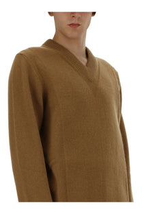Jil Sander men’s camel-colored beige v-neck sweater with long sleeves ribbed collar and vertical seam detailing