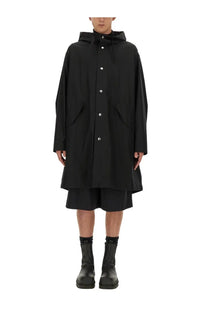 Jil sander men’s black hooded trench coat with silver buttons and asymmetrical hemline front view