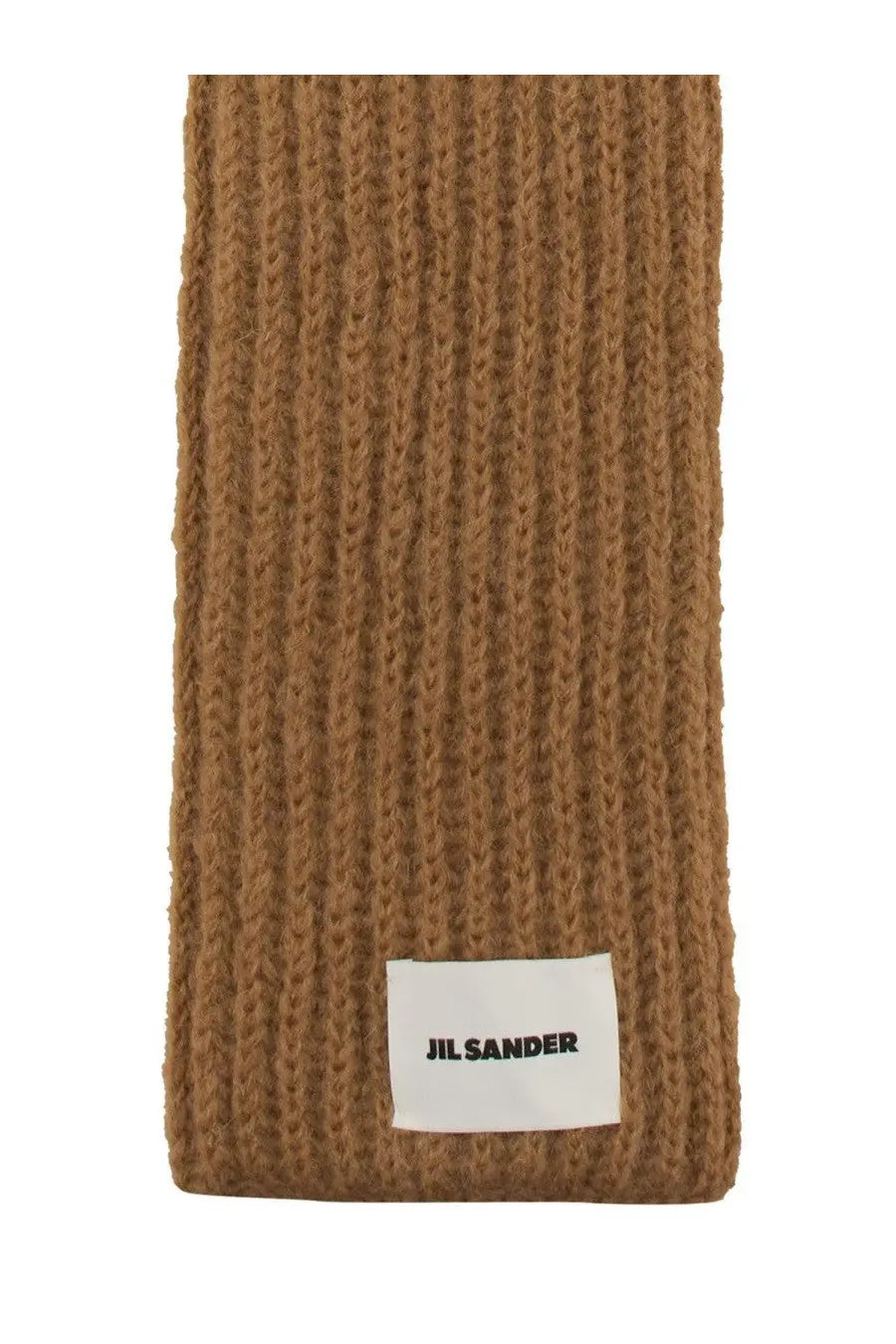 A tan ribbed knit jil sander men’s scarf with a white label at the bottom in beige color