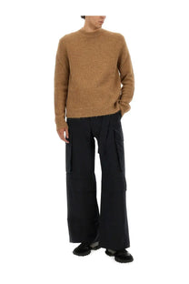 A cozy camel-colored jil sander men’s wool blend sweater with textured knit and ribbed crew neckline and cuffs