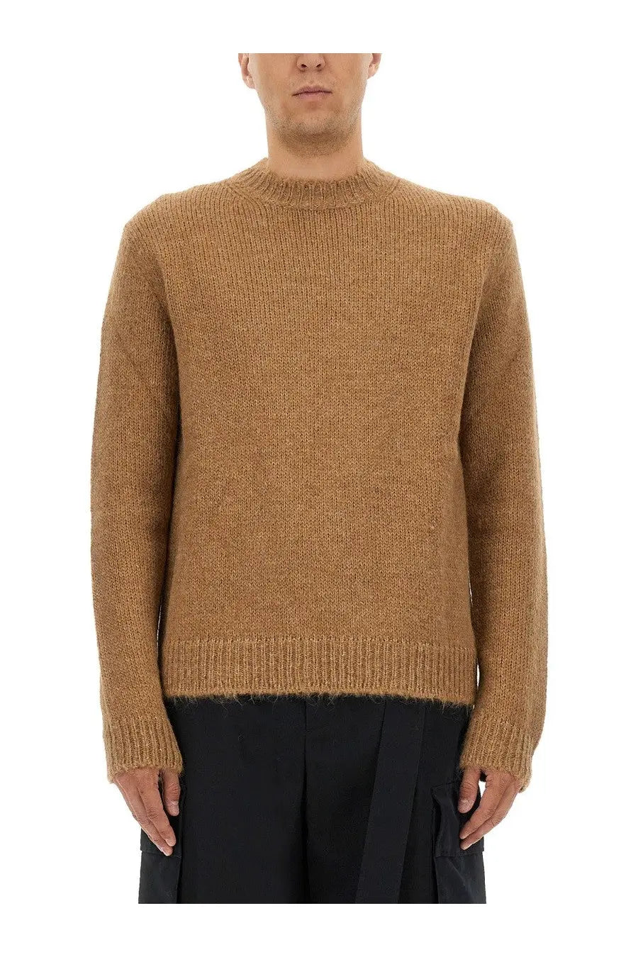 A warm camel-colored ribbed-knit wool blend sweater with a classic crew neck and long sleeves by Jil Sander men