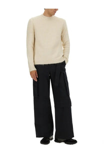 Cream-colored jil sander men’s wool blend ribbed knit sweater with slightly frayed hem in white