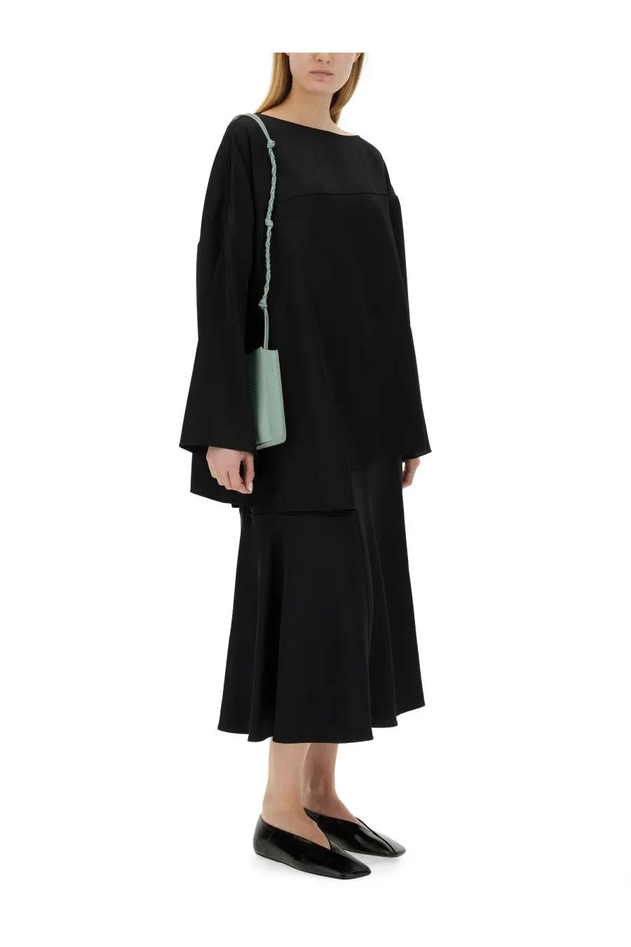 Jil sander women’s asymmetrical top in black long-sleeved knit with boat neckline for elegant wear