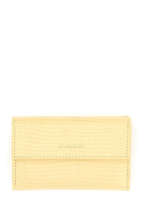 A jil sander women’s baby wallet in pale yellow textured leather with a subtle embossed brand name