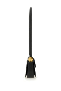 Jil Sander women’s black leather crossbody bag with gold-tone circular clasp for stylish everyday use