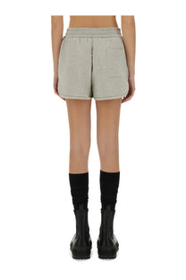 Light gray heathered jil sander women cotton terry shorts with relaxed fit and single back pocket shown from back side
