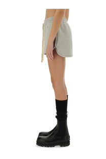 Light gray jil sander women’s cotton terry shorts with soft texture drawstring waist and side slits