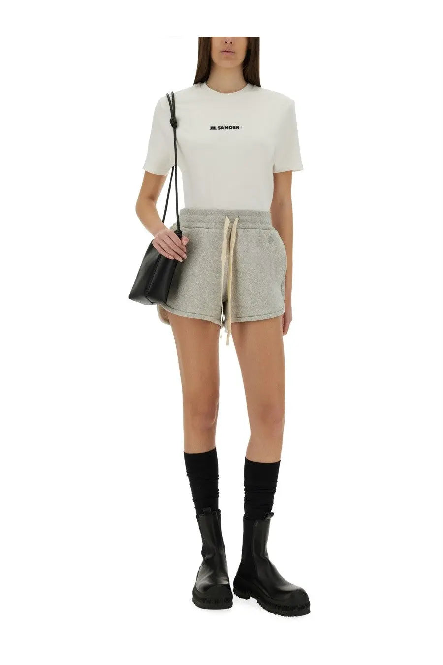 White jil sander cotton t-shirt with black logo on chest paired with grey terry shorts for women
