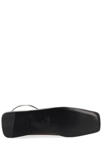 Black leather shoe with square heel and silver metal strap detail from jil sander women’s dancer ring red collection