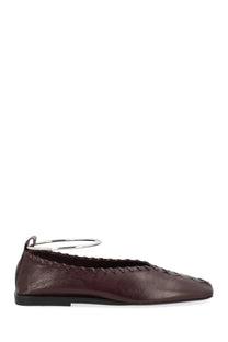 Back view of jil sander women’s dancer ring red burgundy leather flat shoe with braided detailing and silver metal ring