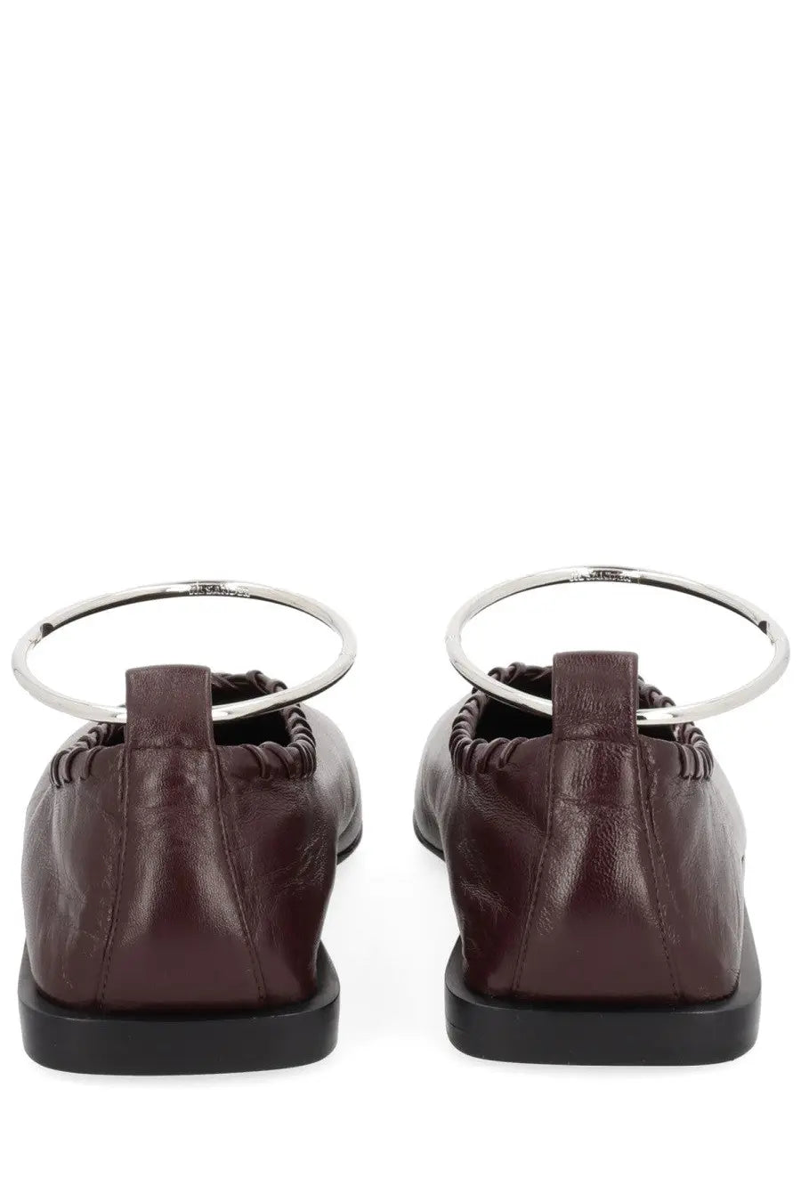 Back view of jil sander women’s dancer ring red burgundy leather loafers with silver metal ring detail