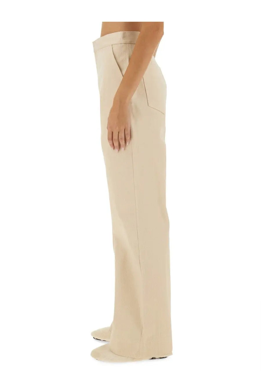 Cream-colored jil sander women’s flared pants with wide-leg cut, sleek minimalist design, and clean stitching
