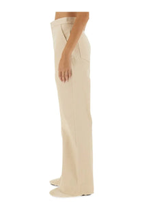 Cream-colored jil sander women’s flared pants with wide-leg cut, sleek minimalist design, and clean stitching