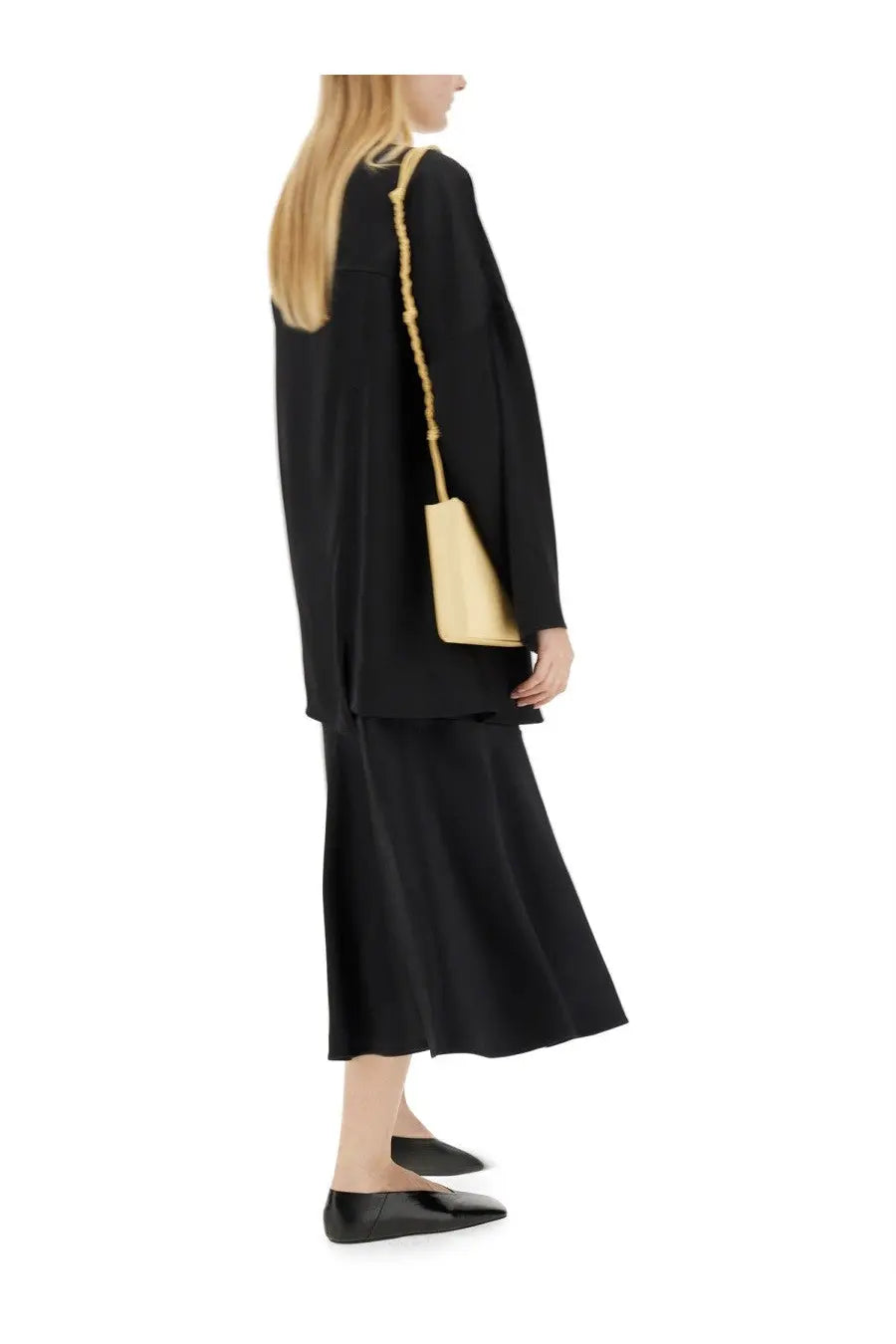 Gold-tone beaded shoulder bag with structured rectangular body and chain strap paired with jil sander black flared skirt