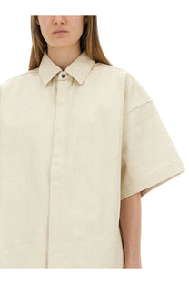 Jil Sander women’s beige heavy cotton shirt with a loose fit, classic collar, and short sleeves