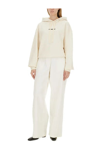 Jil Sander women’s cream oversized hoodie with subtle black logo across chest in soft cotton fabric