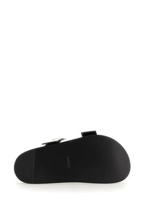 Jil Sander women’s black leather slide sandal with sleek minimalist design and small silver metallic buckle detail