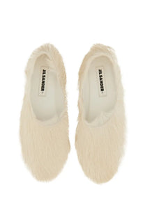 Cream-colored fluffy fur slip-on low leather slippers for women by Jil Sander in white