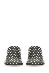 Black leather mules by Jil Sander featuring nappa leather and a dense pattern of silver studs in black